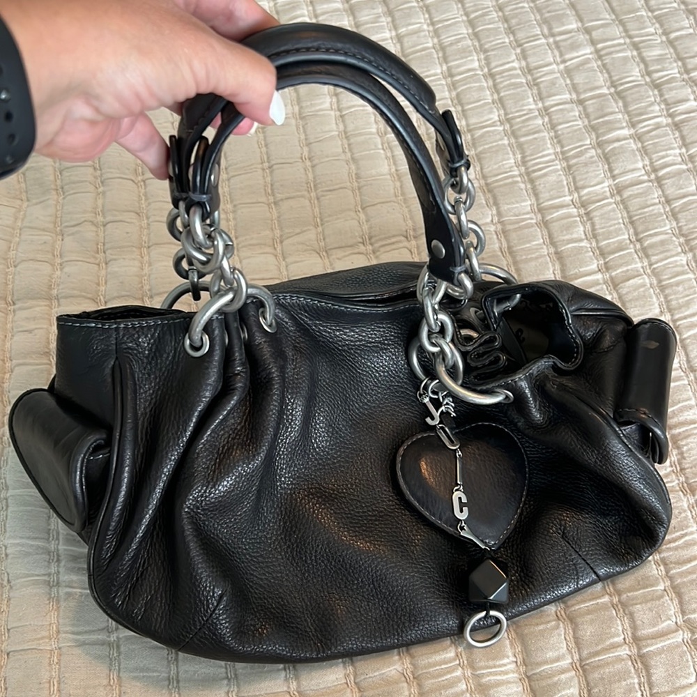 Juicy Couture, black leather hand bag.